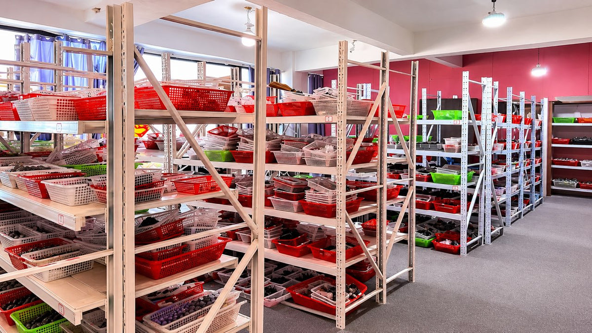 Wholesale crystal orders organized in baskets in an area awaiting shipment.
