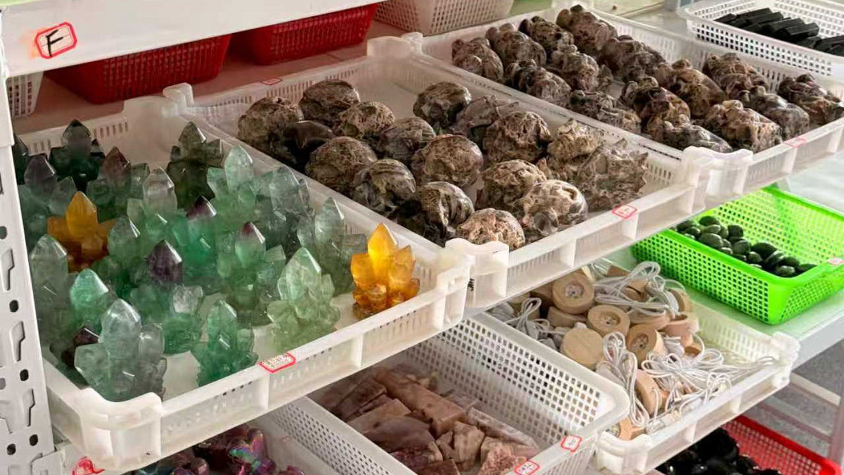 Wholesale crystal products organized in baskets for inventory planning.