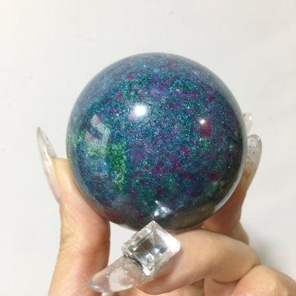 Crystal sphere for ornament ruby in kyanite sphere