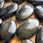Obsidian palm stone