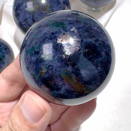 Crystal sphere Iolite with emerald and mica sphere