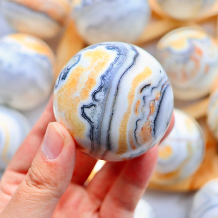 Crystal sphere Orange zebra calcite sphere / balls
